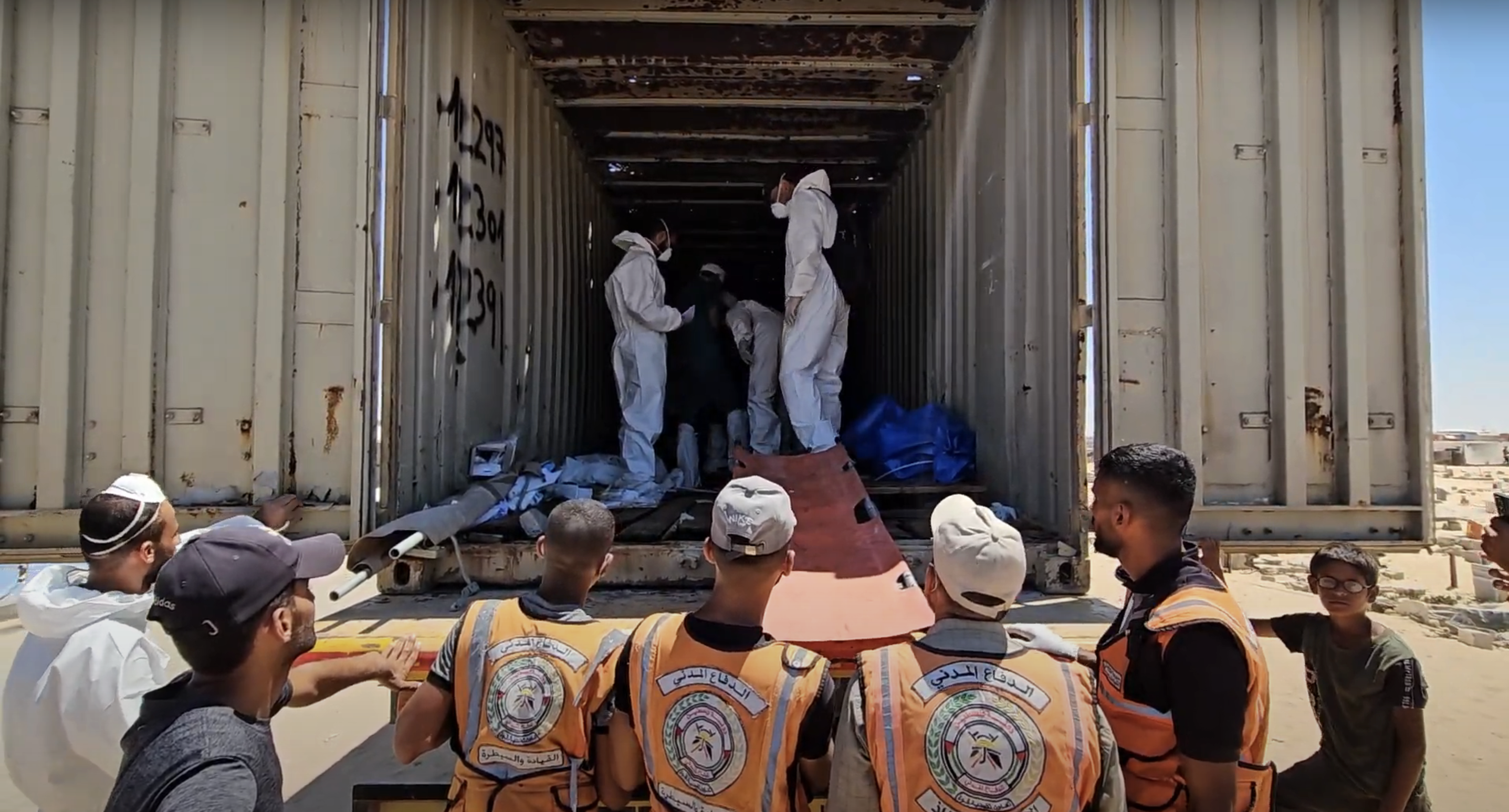 Gaza civil defense bury 80 unidentified Palestinians after Israel delivers body bags to Karam Abu Salem